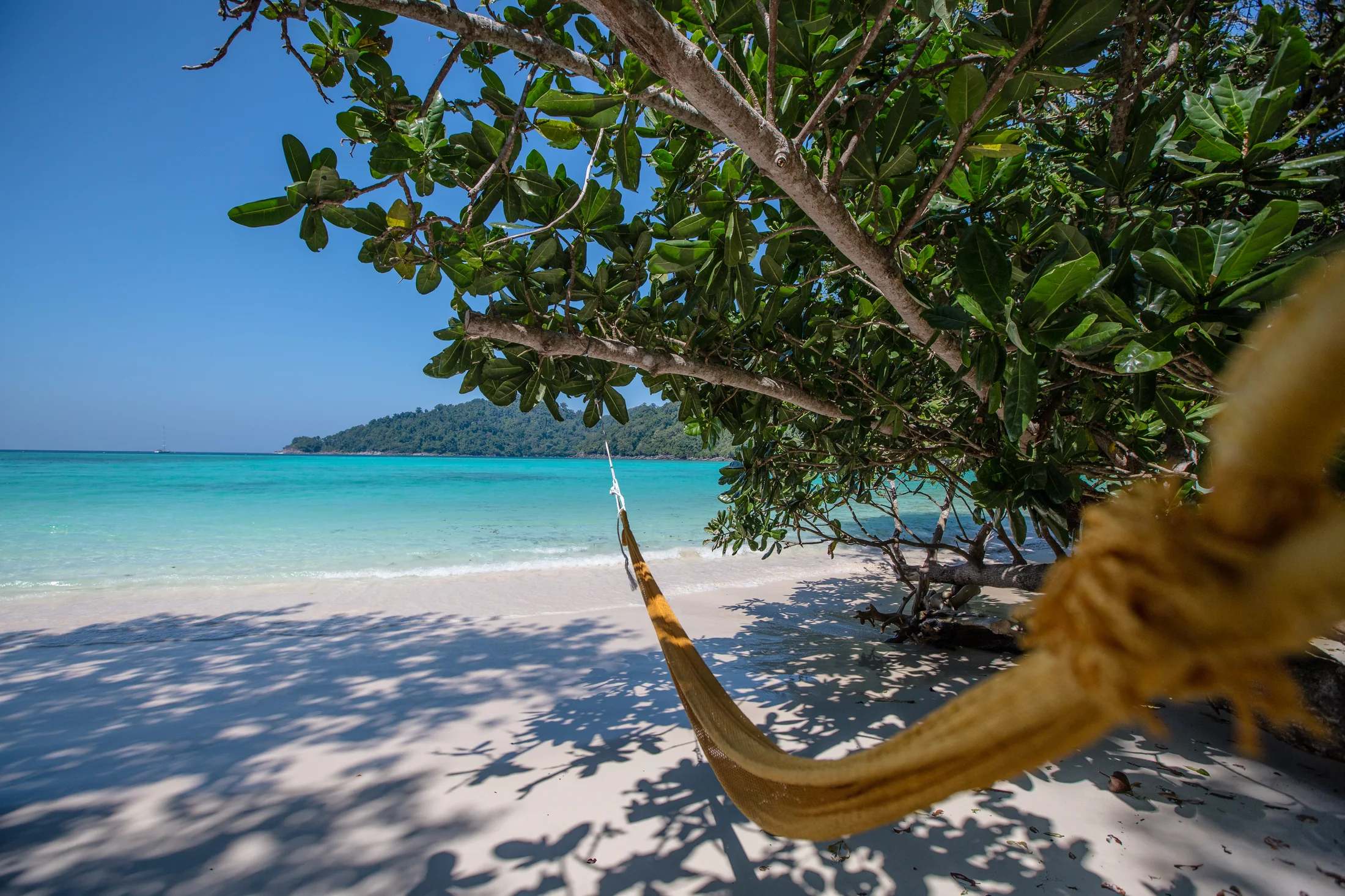 Hammock overlooking turquoise water at Mai Ngam Beach