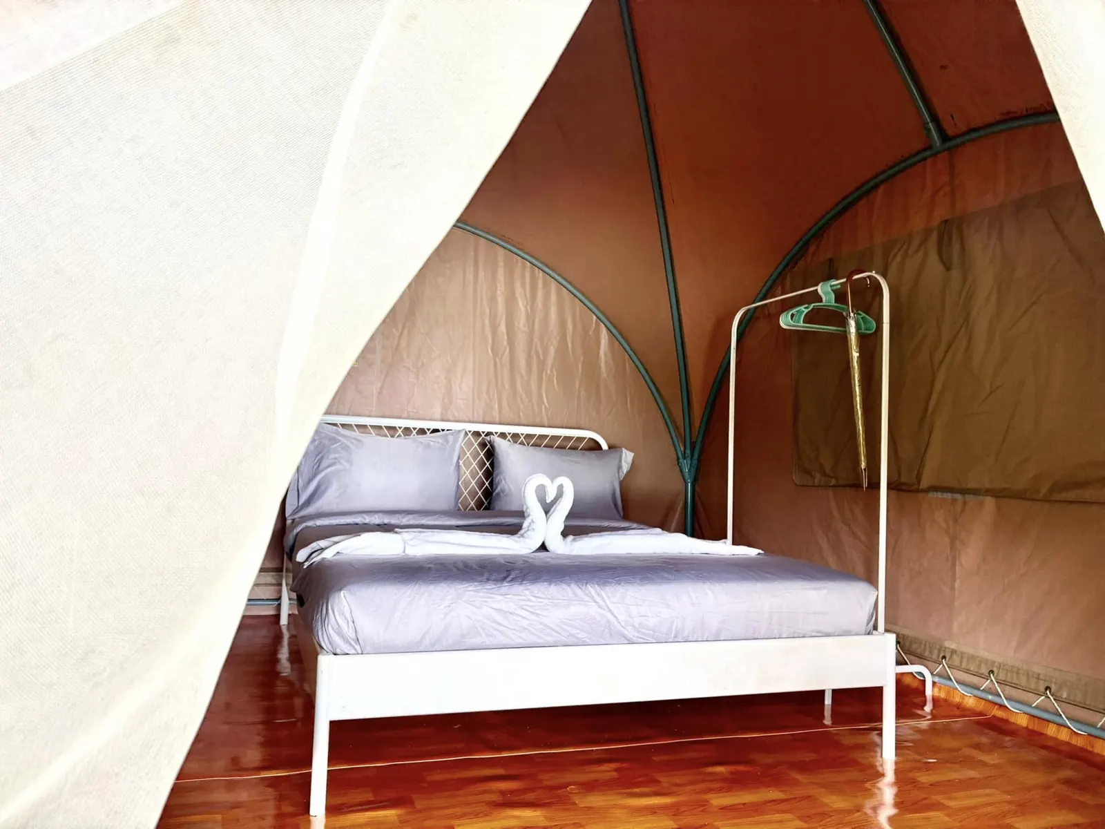 Close view of the bed inside an air-conditioned tent