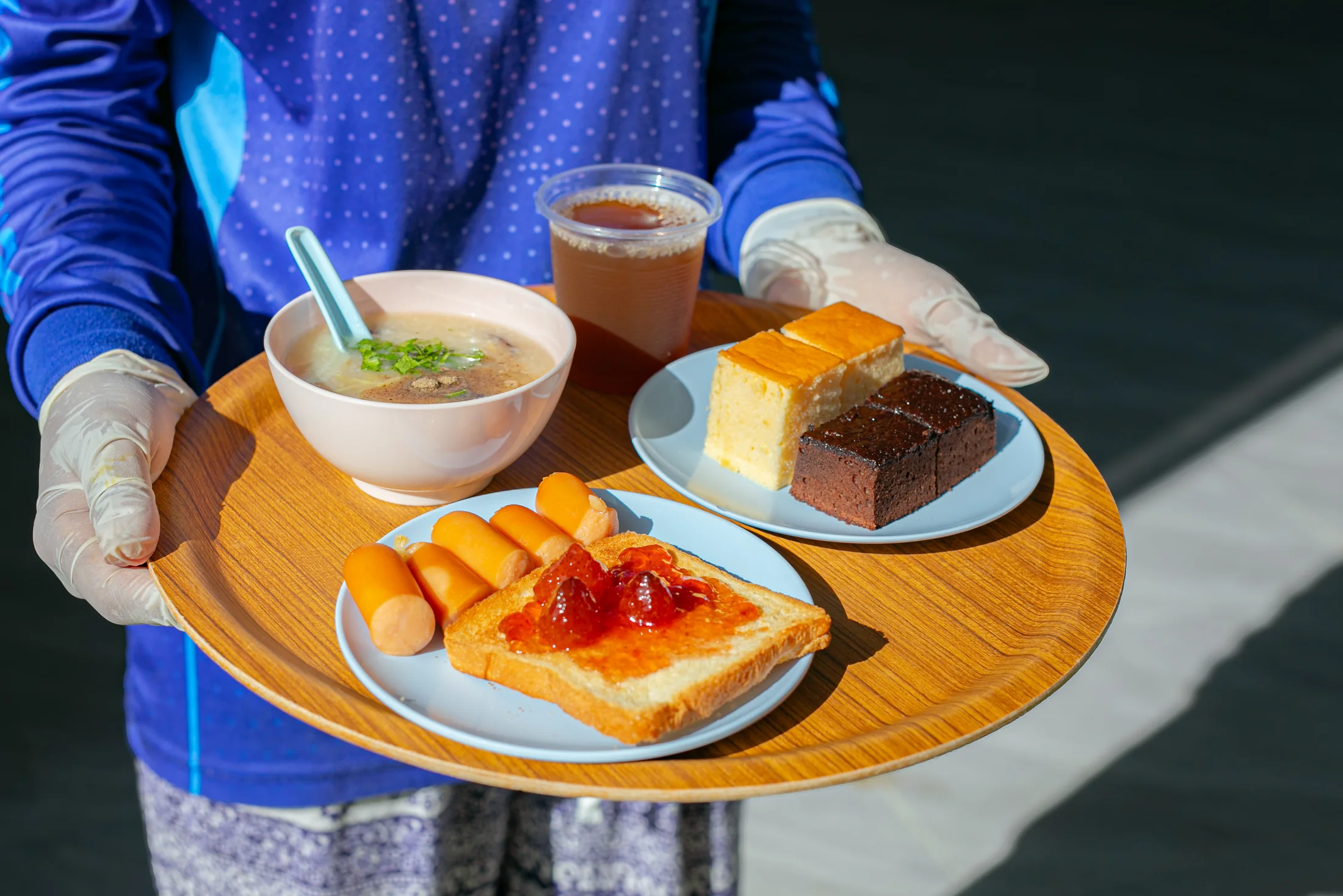 Island breakfast tray with porridge, toast, fruit and cake